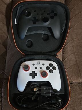 Nintendo White and Black Switch Controller with Red Stick Rings